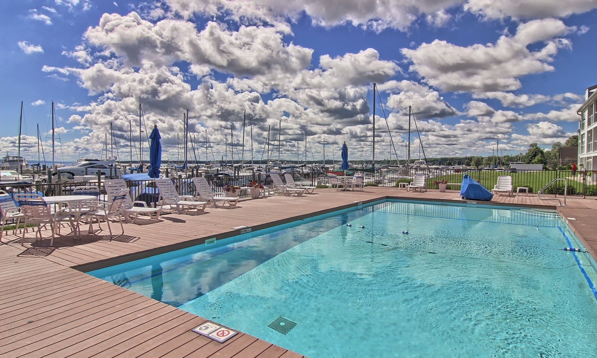 Charlevoix Condo | Condo on Lake Charlevoix with marina views and pool access