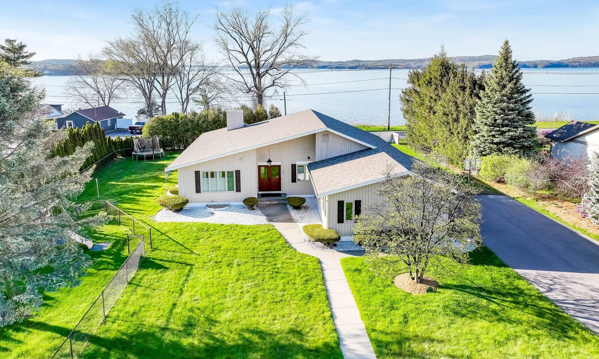 Colchester House | Lakefront home with pool, beach access, central AC, washer/dryer, & fireplace