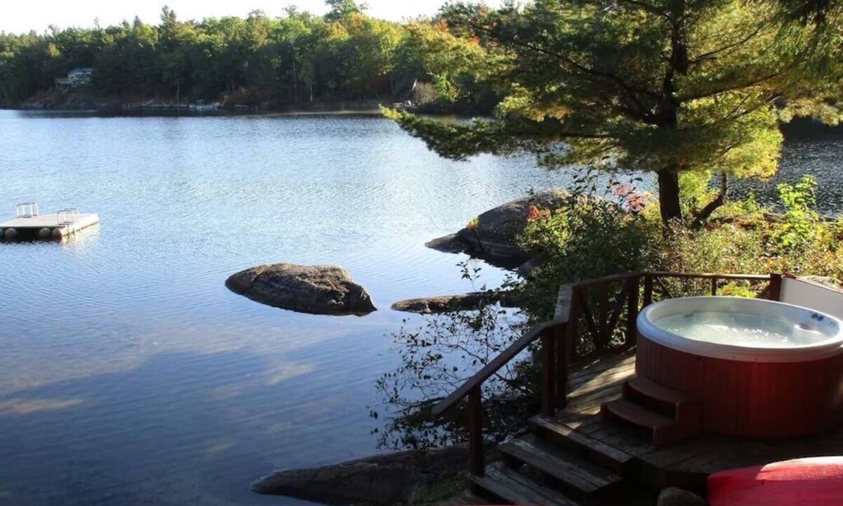Town of Hermon Cottage | Lakeside Cottage near Adirondacks, Hot Tub, Pontoon Boat, Kayaks & Paddle Board