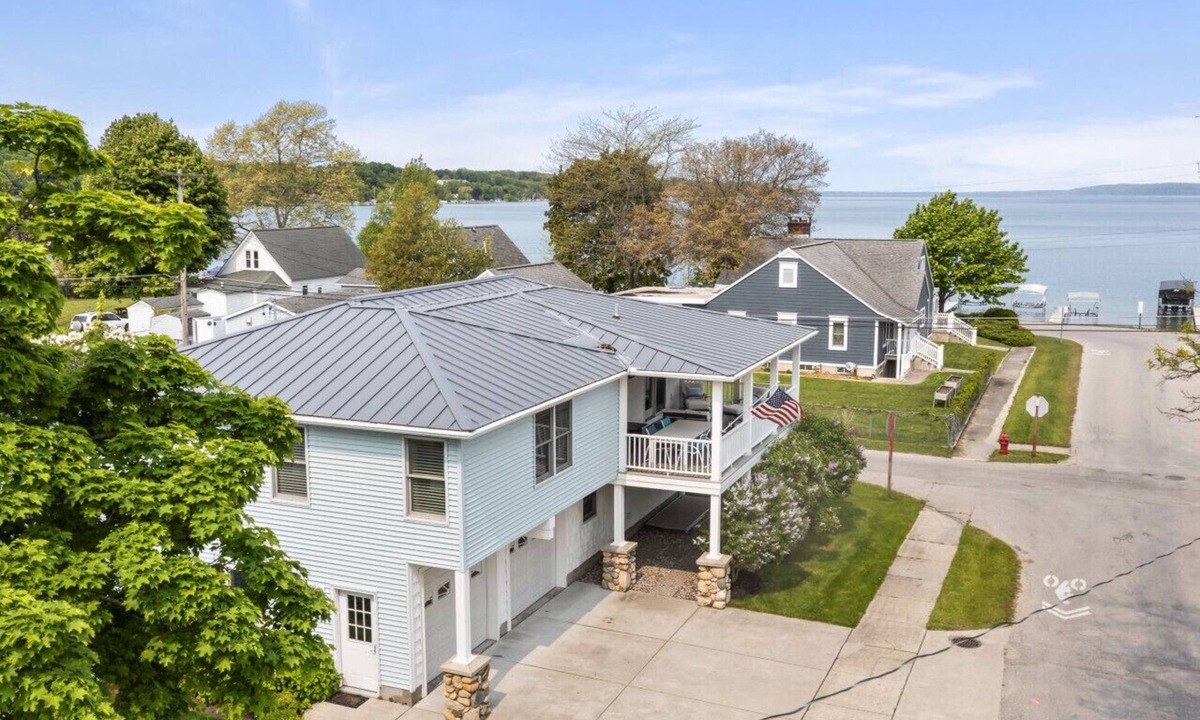 Beulah House | Modern-coastal retreat with lake views, covered deck, and walkable downtown Beulah location.