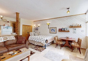 Amazing condo with river & mountain views, hot tub, & wood-burning fireplace