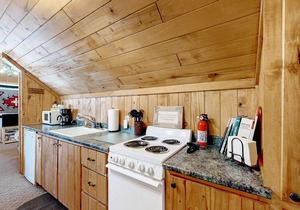 Mountain-view studio with private balcony, wood stove, and fast WiFi
