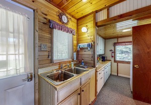 Two cozy, lakefront cottages w/2 docks, a patio, firepit, 2 gas grills, & WIFI