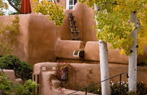 Historic Eastside House | Authentic Southwest Elegance ~Walk to Plaza, Kiva Fireplaces, Private
