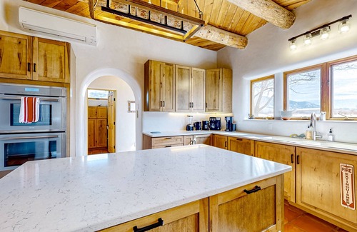 Arroyo Seco House | Dog-friendly villa & studio with mountain view, hot tub, roof deck, & EV charger