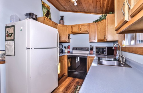 St Germain Cabin | Lakefront cabin with a wood burning fireplace & screen porch