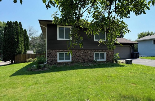 North Saint Paul House | 2000 sq ft home with a swimming pool and a hot tub
