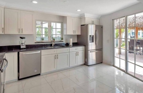 Lighthouse Point House | 4BR Tiki Villa, Pool, Spa, Dock & Private Waterfront