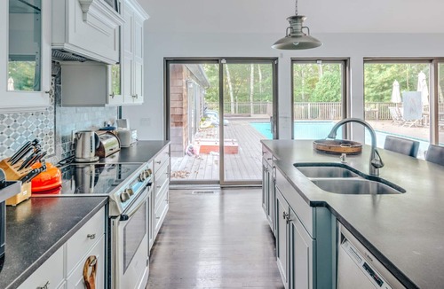 Springs House | Ample Decking, Large Pool, Finished Lower Level with Full Service Gym,.