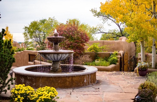 Historic Eastside House | Authentic Southwest Elegance ~Walk to Plaza, Kiva Fireplaces, Private