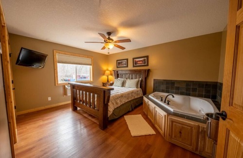 Isle Resort | Cabin 8 Our Romantic Suite offers a jetted tub and views of Mille Lacs lake