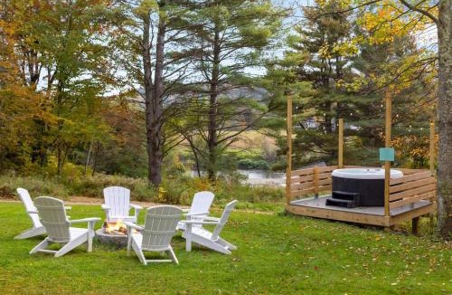 Johnson House | Caboose Tiny Home on river with hot tub near Stowe