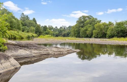 Johnson House | Caboose Tiny Home on river with hot tub near Stowe