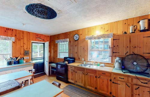 Charlotte Cottage | Century-old lakefront Victorian on a private island with boats & beach - dogs OK
