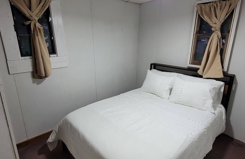 Garrison Cabin | Charming 2-bedroom cabin, offering AC and WiFi for a delightful stay.
