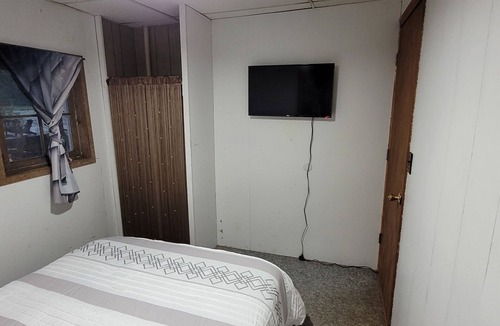 Garrison Cabin | Charming 2-bedroom cabin, offering AC and WiFi for a delightful stay.