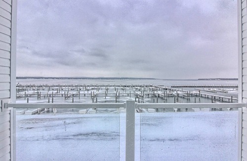 Charlevoix Condo | Condo on Lake Charlevoix with marina views and pool access