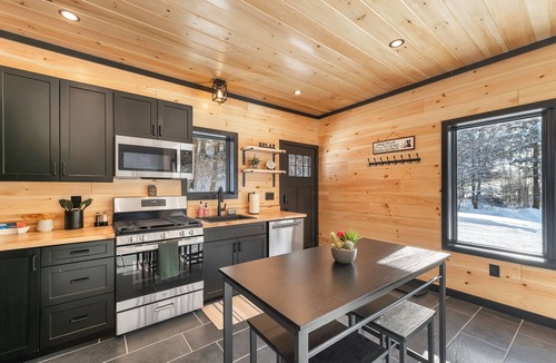 Norwich House | Cozy 2BR/1BA cabin for 6. Fireplace, outdoor fire pit, hot tub, and soaking tub.