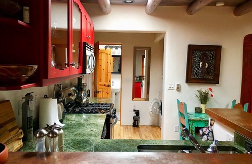 Taos Condo | Cozy Casa Carmelita features a Brilliant Kiva Fireplace, Unique Patio & Hot Tub!