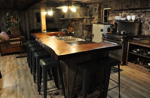Cleveland Cabin | Cozy up in this rustic Stone Lodge and relax by the fireplace