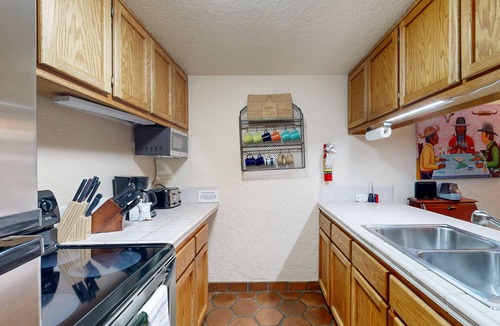 Taos Ski Valley Condo | Designer Forest-View Condo with Balcony, Wood Stove & Sunroom - Near Slopes