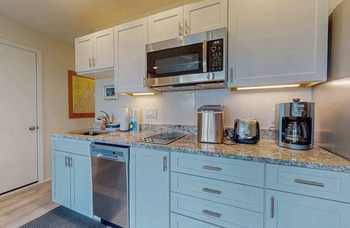 Glen Arbor Condo | Desirable beachfront condo in Glen Arbor with patio, fireplace, kitchenette & AC