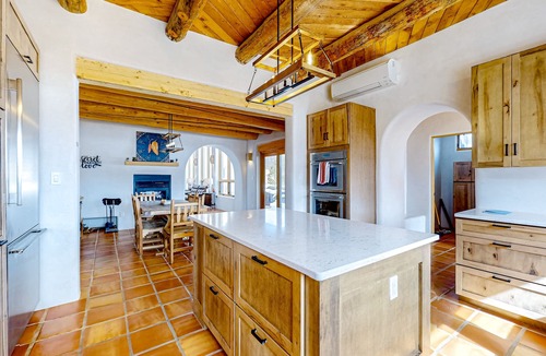 Arroyo Seco House | Dog-friendly villa & studio with mountain view, hot tub, roof deck, & EV charger