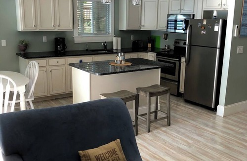 Port Douglass House | Enjoy Modern Amenities and Fun on the Water with Kayaks & Paddle Boat
