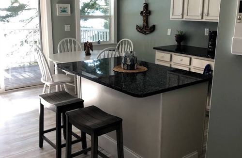 Port Douglass House | Enjoy Modern Amenities and Fun on the Water with Kayaks & Paddle Boat