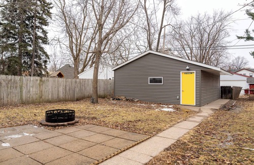 Midway House | Follow the Yellow Front Door to a welcoming home close to everything.
