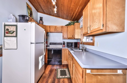 St Germain Cabin | Lakefront cabin with a wood burning fireplace & screen porch