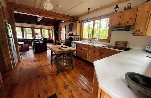 Town of Hermon Cottage | Lakeside Cottage near Adirondacks, Hot Tub, Pontoon Boat, Kayaks & Paddle Board