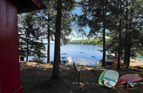 Town of Hermon Cottage | Lakeside Cottage near Adirondacks, Hot Tub, Pontoon Boat, Kayaks & Paddle Board