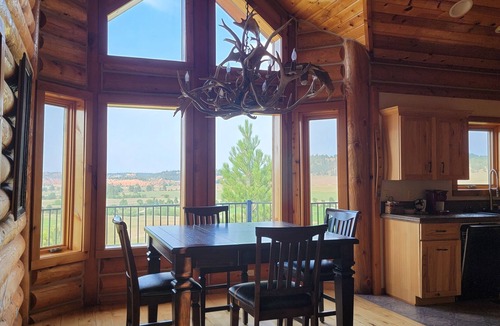 Hulett House | Large garage for bikes. Beautiful log home. On golf course.