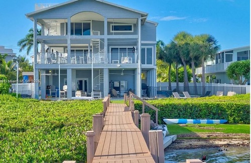 Buccaneer Point Ski Chalet | Luxury Oceanfront Mansion With Sea Access, Including a Private Boat and Jet Ski.