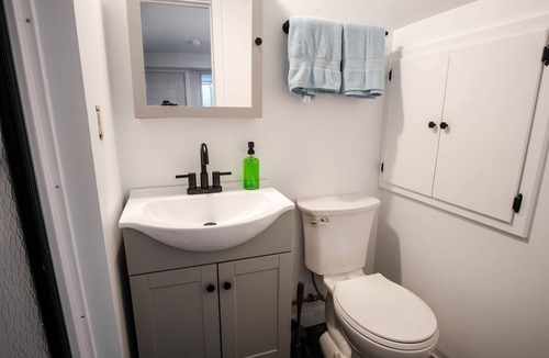 Riverview Apartment | Modern 1 bed basement unit for traveling professionals with garage and laundryn