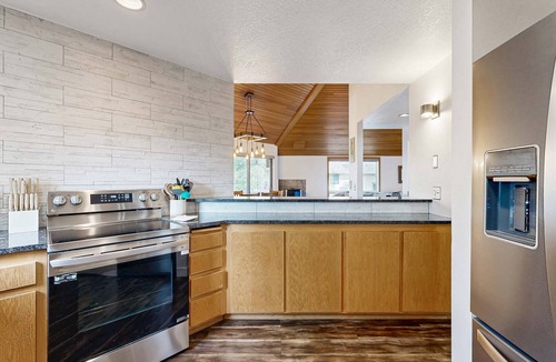 Overlook Park House | Multi-level home with private hot tub, decks, and SHARC passes provided