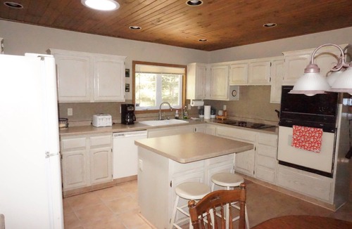 Solon Springs Cabin | Northwoods lake home with gentle slope to clear lake with sandy beach