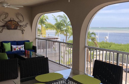 Breezeswept Beach Estates House | Oceanfront Rental With Heated Pool, Dock & Tiki Hut