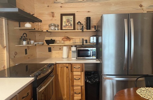Amery Cabin | Private 3bdr cabin on Apple River kayaks, SUPS, and paddle boat. Pet friendly!