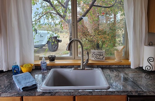 Taos House | Quiet, Pet Friendly Home with Mountain Views. Fenced area for dogs to roam
