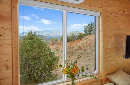Arroyo Hondo House | Rainbow Tiny Home w Mountain View, Hot Tub, and Hot Springs just 2 miles away.
