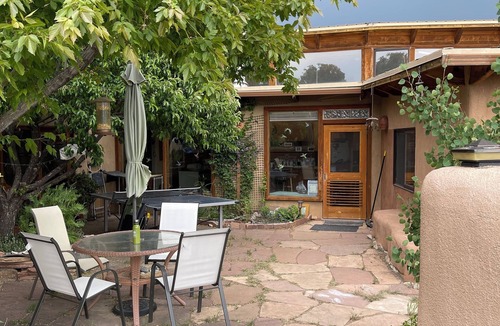 Arroyo Hondo House | Rainbows, Rivers and Sunsets: Unique off-grid solar 3-bedroom home in El Prado