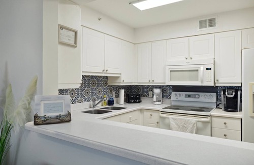 Folly Beach Condo | Riverfront, Community Pool & Dock, Short walk across bridge to the beach, shops & restaurants!