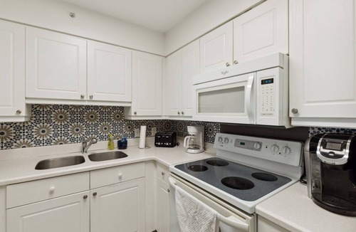 Folly Beach Condo | Riverfront, Community Pool & Dock, Short walk across bridge to the beach, shops & restaurants!