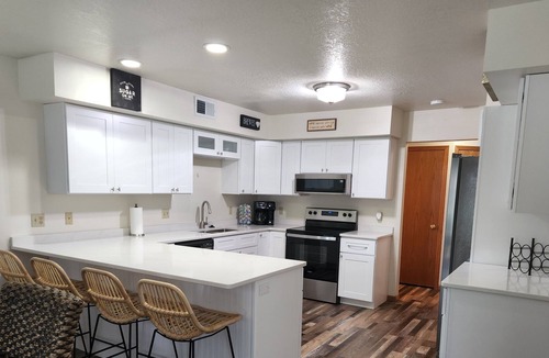 Tomah House | Spacious Townhome in quiet neighborhood with firepit!