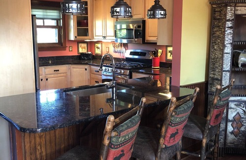 Lake Placid House | Stunning Lake Placid family friendly cozy wooded townhome minutes from town