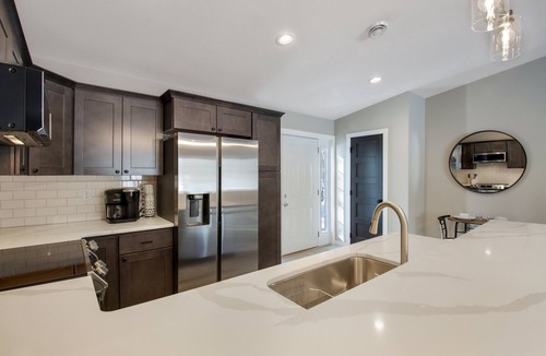 Cumberland Condo | Up North Living! Fully renovated one-level living home in wooded lot near lake.