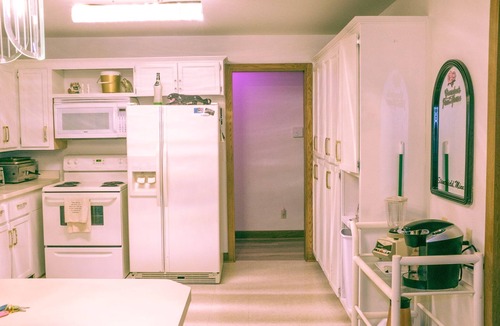 Stanchfield House | Vintage kitsch 70s/80s themed house with indoor pool and backyard creek