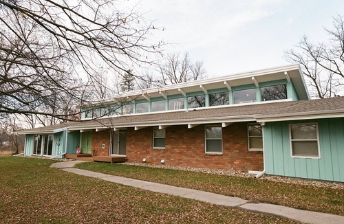 Stanchfield House | Vintage kitsch 70s/80s themed house with indoor pool and backyard creek